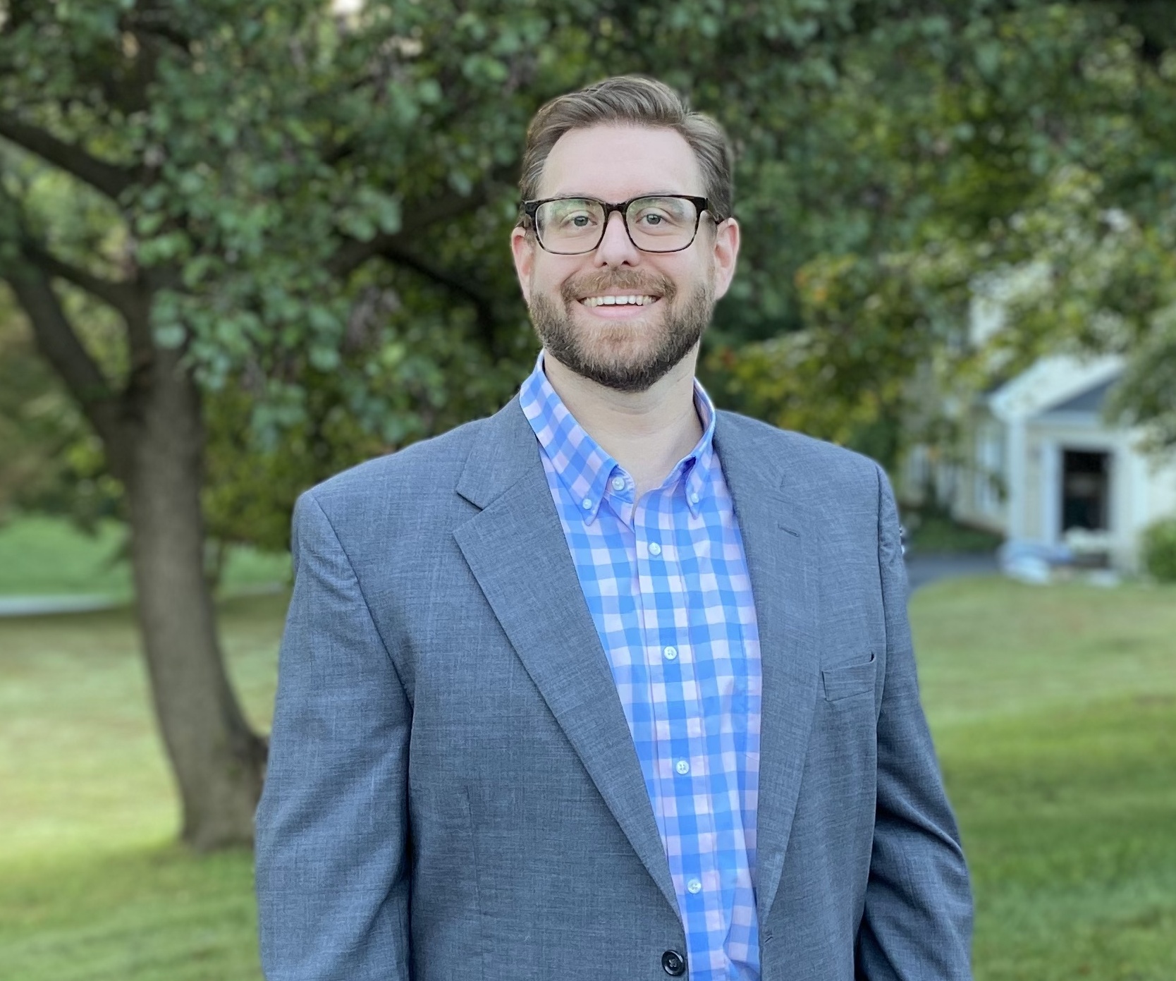 Image of Brett in front of some trees